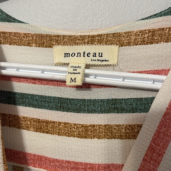 A multicoloured dress cute and fun dress. Stretches in back. Cinches at waste. - Picture 4 of 4